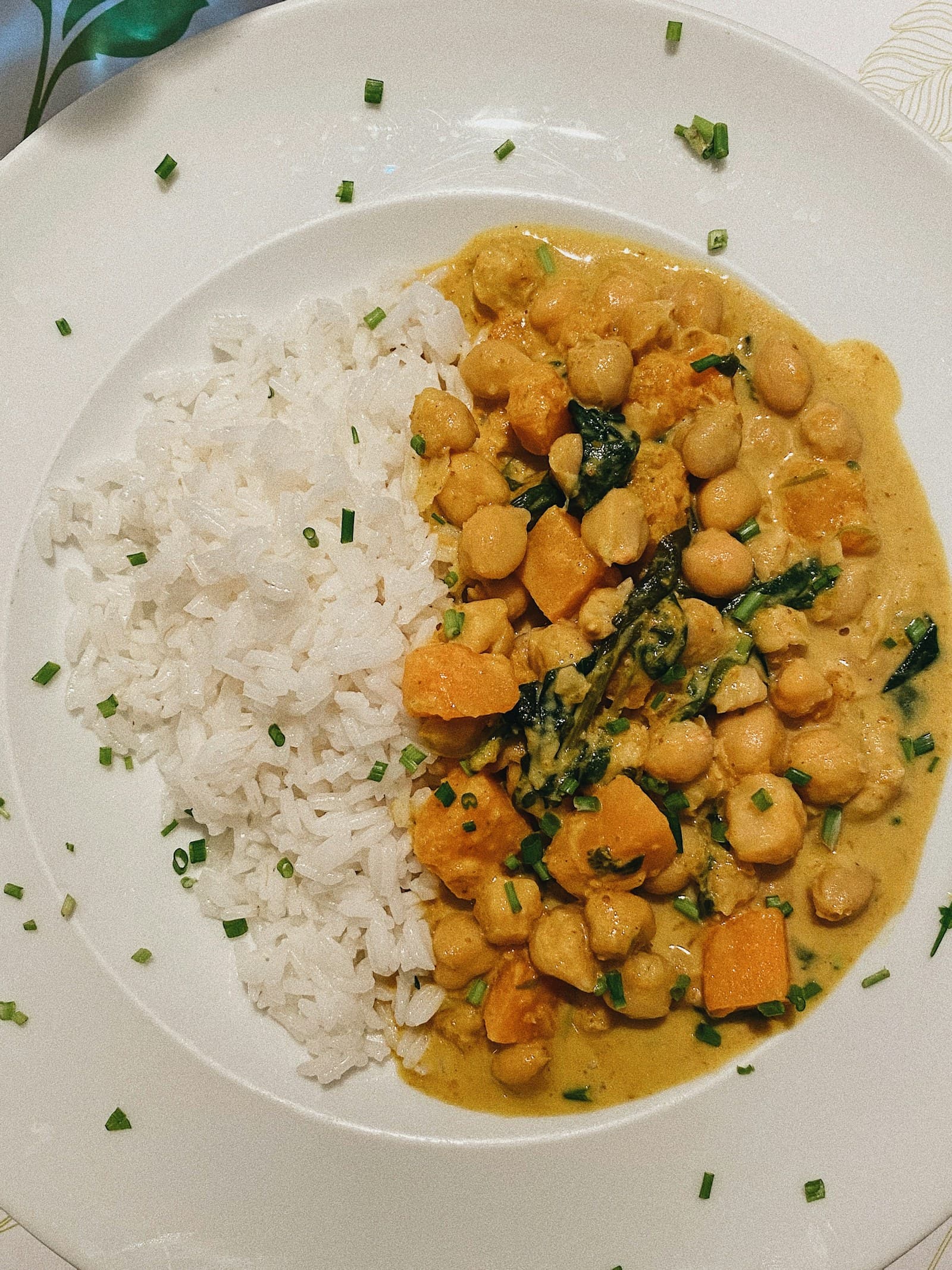 Photo of chickpea curry beside white rice